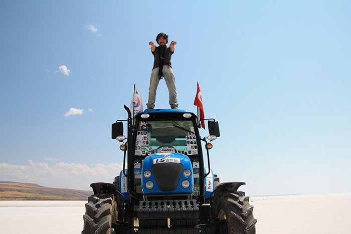 Kang Kitae poses atop his tractor during a trip in Turkey in 2012.